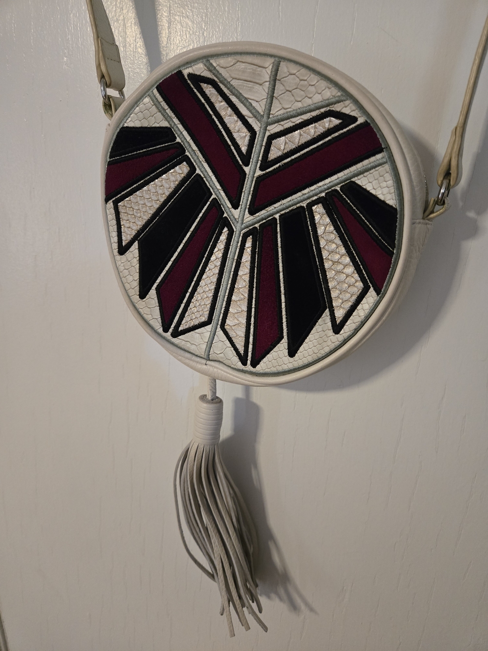 Sam Edelman Cream Round Crossbody with Burgundy & Black Inlay and Tassel